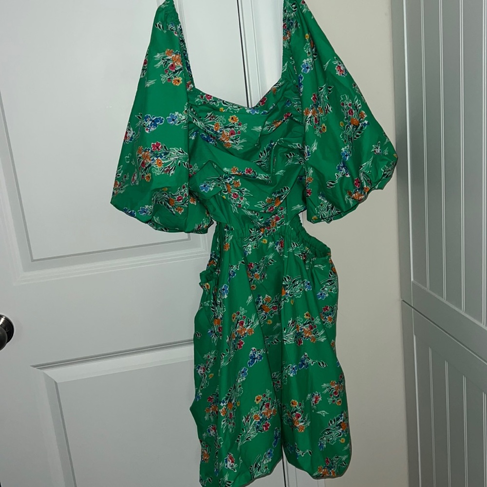 Green cut out dress with pockets.